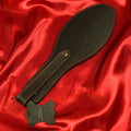 BDSM läderpaddel SHOE svart med röda sömmar från Chambers of Love